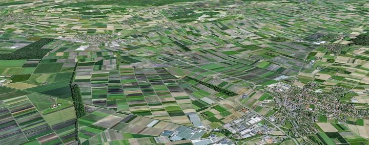 Ein Blick auf die ausgedehnten Ackerflächen im Berner Seeland. Vorne rechts Kerzers und Ried bei Kerzers, oben links Müntschemier und Ins QUELLE: SWISSTOPO / GEO.ADMIN.CH